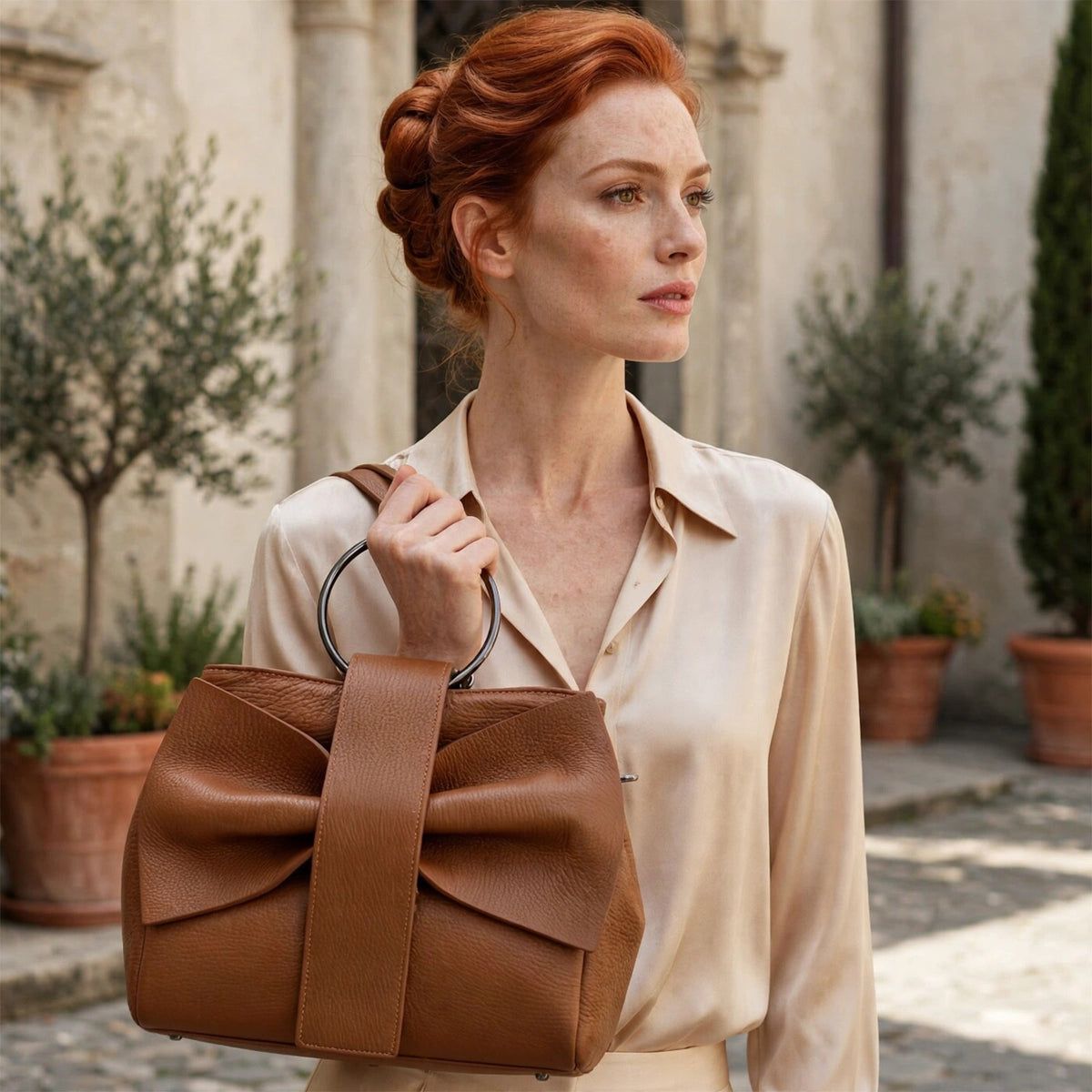 Bow in genuine Italian leather, worn